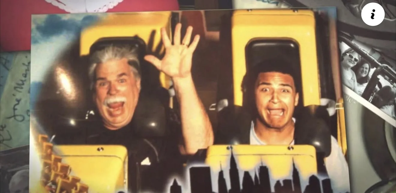My father, Kevin, and my son, Torel, on a roller coaster — hands up and gripping the bar.