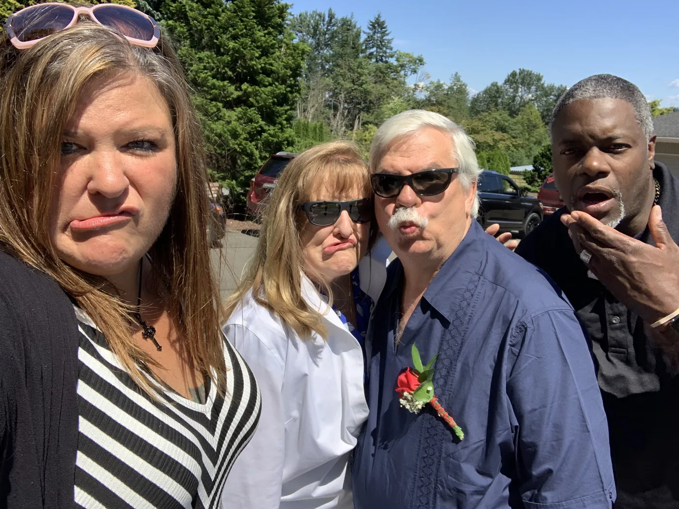 Christmas card season. The first rule was: silliest face wins. — Jennifer, Linda, Kevin, and Michael. Kevin Bagley in the middle, doing what he did.