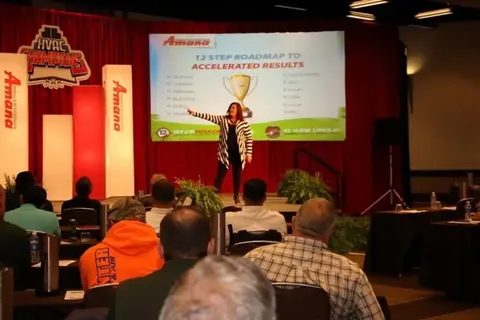 Jennifer delivering a keynote presentation at an industry conference