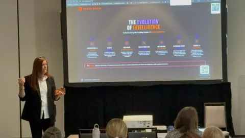 Jennifer walking a full room through The Evolution of Intelligence keynote